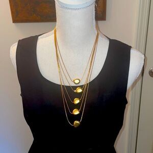 Gold tone necklace drape